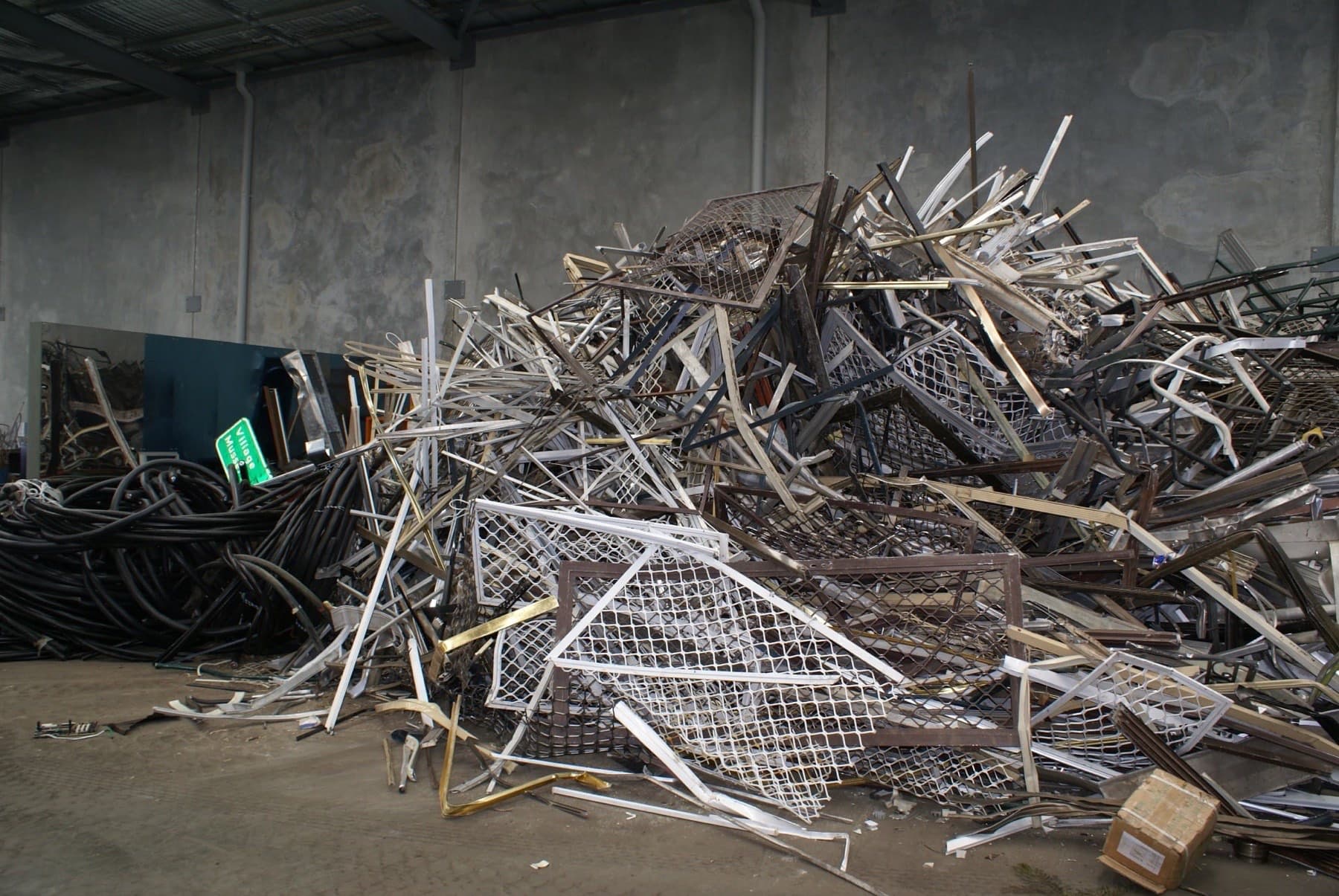 Warehouse stockpile of aluminium extrusion and coiled cable